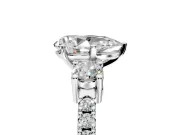 3 Stone Engagement Ring Setting for Pear-Shaped Center with Round Cut Side Accents and Prong Head in Platinum