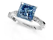 Side Accent Engagement Ring Setting for Fancy Blue Princess Cut Center with Accent Shoulders and Prong Head in Platinum