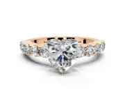 Shared-Prong Engagement Ring Setting for Heart-Shaped Center with Graduated Accents and Prong Head in Rose Gold