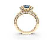 Pave Engagement Ring Setting for Fancy Blue Emerald Cut Center with Curved Accent Rows, Openwork and Prong Head in Yellow Gold