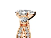 3 Stone Engagement Ring Setting for Pear-Shaped Center with Pave Twist Band and Prong Head in Rose Gold