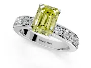 Solitaire Engagement Ring Setting for Fancy Yellow Emerald Cut Center with Channel-Set Accents and Prong Head in Platinum