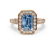 Bezel-Framed Halo Engagement Ring Setting for Fancy Blue Emerald Cut Center with Pave Band and Prong Head in Rose Gold