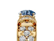 Pave Engagement Ring Setting for Fancy Blue Round Cut Center with Curved Accent Rows, Openwork and Prong Head in Yellow Gold