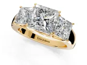 3 Stone Engagement Ring Setting for Princess Cut Center with Raised Basket Heads and Prong Head in Yellow Gold