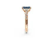 Solitaire Engagement Ring Setting for Fancy Blue Emerald Cut Center with Trailing Leaf Accent Band and Prong Head in Rose Gold
