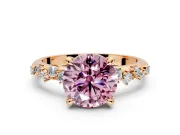 Solitaire Engagement Ring Setting for Fancy Pink Round Cut Center with Trailing Leaf Accent Band and Prong Head in Rose Gold