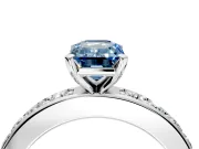 Solitaire Engagement Ring Setting for Fancy Blue Emerald Cut Center with Channel-Set Accents and Prong Head in Platinum