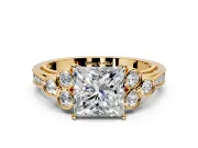 Cluster Engagement Ring Setting for Princess Cut Center with Bezel Accent Clusters and Prong Head in Yellow Gold