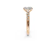Cluster Engagement Ring Setting for Radiant Cut Center with Round Cut Accent Band and Prong Head in Rose Gold