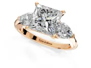 3 Stone Engagement Ring Setting for Princess Cut Center with Large Pear-Shaped Accents and Prong Head in Rose Gold
