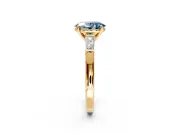 3 Stone Engagement Ring Setting for Fancy Blue Oval Center with Tapered Baguettes, Plain Band and Prong Head in Yellow Gold