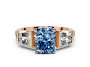 Channel-Set Engagement Ring Setting for Fancy Blue Radiant Cut Center with Baguette Band and Prong Head in Rose Gold