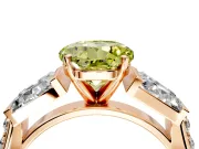 Channel-Set Engagement Ring Setting for Fancy Yellow Round Cut Center with Baguette Band and Prong Head in Rose Gold