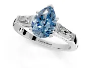 3 Stone Engagement Ring Setting for Fancy Blue Pear-Shaped Center with Tapered Baguettes, Plain Band and Prong Head in Platinum