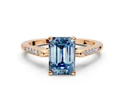 Solitaire Engagement Ring Setting for Fancy Blue Emerald Cut Center with Channel Accents and Prong Head in Rose Gold