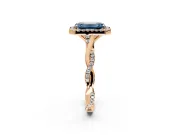 Halo Engagement Ring Setting for Fancy Blue Emerald Cut Center with Twist Band and Prong Head in Rose Gold