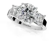 3 Stone Engagement Ring Setting for Round Cut Center with Matching Side Accents and Prong Head in Platinum
