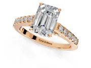 Solitaire Engagement Ring Setting for Emerald Cut Center with Crossover Accents and Prong Head in Rose Gold