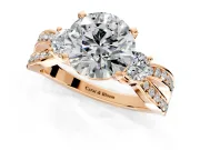 3 Stone Engagement Ring Setting for Round Cut Center with Pave Twist Band and Prong Head in Rose Gold
