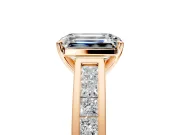 Solitaire Engagement Ring Setting for Emerald Cut Center with Princess Cut Channel Band and Prong Head in Rose Gold