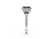 Halo Engagement Ring Setting for Fancy Blue Emerald Cut Center with Openwork Halo, Pave Band and Prong Head in Platinum