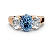 3 Stone Engagement Ring Setting for Fancy Blue Oval Center with Raised Basket Heads and Prong Head in Rose Gold