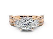 3 Stone Engagement Ring Setting for Cushion Cut Center with Pave Twist Band and Prong Head in Rose Gold