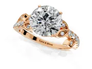 Leaf Motif Engagement Ring Setting for Round Cut Center with Pave Band and Prong Head in Rose Gold