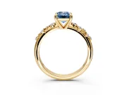 Solitaire Engagement Ring Setting for Fancy Blue Emerald Cut Center with Trailing Leaf Accent Band and Prong Head in Yellow Gold