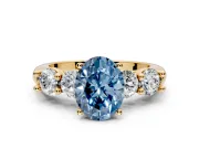 5 Stone Engagement Ring Setting for Fancy Blue Oval Center with Graduated Accents and Prong Head in Yellow Gold