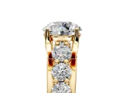Solitaire Engagement Ring Setting for Round Cut Center with Graduated Shared Prongs and Prong Head in Yellow Gold