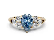 Cluster Engagement Ring Setting for Fancy Blue Pear-Shaped Center with Round Cut Accent Frame and Prong Head in Yellow Gold