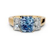 3 Stone Engagement Ring Setting for Fancy Blue Radiant Cut Center with Raised Basket Heads and Prong Head in Yellow Gold
