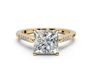 Solitaire Engagement Ring Setting for Princess Cut Center with Channel Accents and Prong Head in Yellow Gold