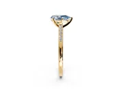 Solitaire Engagement Ring Setting for Fancy Blue Pear-Shaped Center with Channel Accents and Prong Head in Yellow Gold