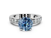 Solitaire Engagement Ring Setting for Fancy Blue Round Cut Center with Channel-Set Accents and Prong Head in Platinum