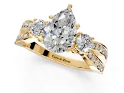 3 Stone Engagement Ring Setting for Pear-Shaped Center with Pave Twist Band and Prong Head in Yellow Gold