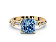 Solitaire Engagement Ring Setting for Fancy Blue Cushion Cut Center with Trailing Leaf Accent Band and Prong Head in Yellow Gold