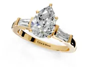 3 Stone Engagement Ring Setting for Pear-Shaped Center with Channel Baguette Accents and Prong Head in Yellow Gold