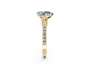 3 Stone Engagement Ring Setting for Fancy Blue Pear-Shaped Center with Round Cut Side Accents and Prong Head in Yellow Gold