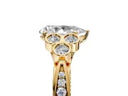 Cluster Engagement Ring Setting for Pear-Shaped Center with Bezel Accent Clusters and Prong Head in Yellow Gold