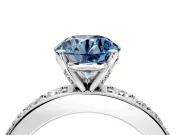 Solitaire Engagement Ring Setting for Fancy Blue Round Cut Center with Channel-Set Accents and Prong Head in Platinum