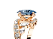 Solitaire Engagement Ring Setting for Fancy Blue Oval Center with Pave Bypass Twist Band and Prong Head in Rose Gold