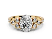 Cluster Engagement Ring Setting for Oval Center with Bezel Accent Clusters and Prong Head in Yellow Gold