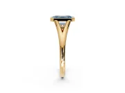 Solitaire Engagement Ring Setting for Fancy Blue Emerald Cut Center with V Split Shank and Bezel Head in Yellow Gold