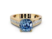 Solitaire Engagement Ring Setting for Fancy Blue Cushion Cut Center with Channel Band and Double Claw Prong Head in Yellow Gold