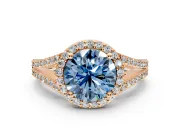 Halo Engagement Ring Setting for Fancy Blue Round Cut Center with Pave Split Shank and Prong Head in Rose Gold