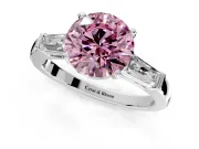 3 Stone Engagement Ring Setting for Fancy Pink Round Cut Center with Tapered Baguettes, Plain Band and Prong Head in Platinum