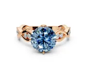 Solitaire Engagement Ring Setting for Fancy Blue Round Cut Center with Accented Twist Band and Leaf Prong Head in Rose Gold